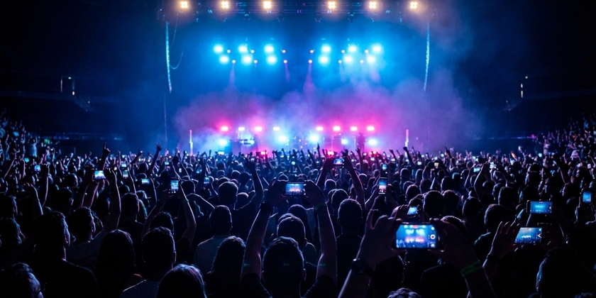 Concert fans attending a 2025 music festival performance.