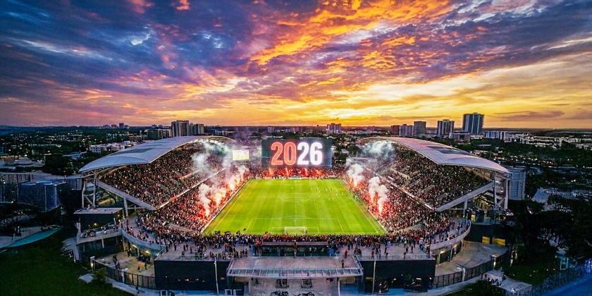 Soccer stadium welcoming 2026 on the screens.
