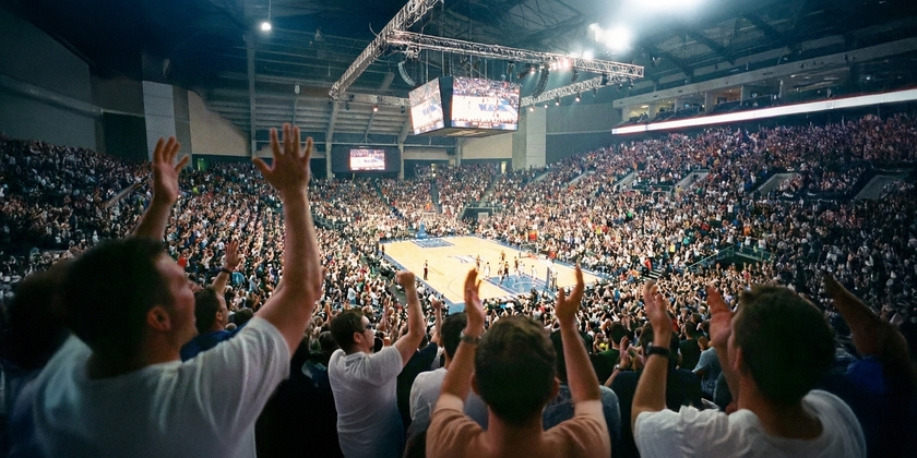 Fans cheering during a high-stakes NBA Finals game.