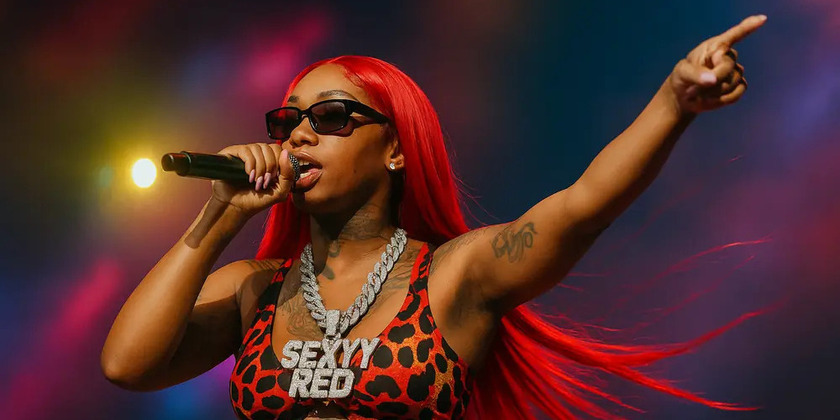 Sexyy Red performs wearing a large necklace. 