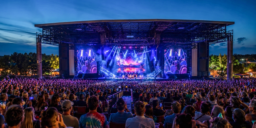 Live concert at Ruoff Music Center showing a massive crowd. 