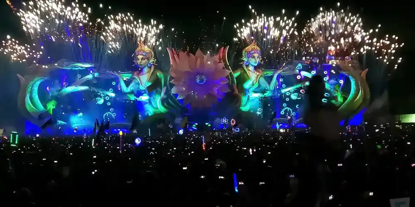 A view of the vibrant lit-up stage at EDC Orlando with a large crowd.