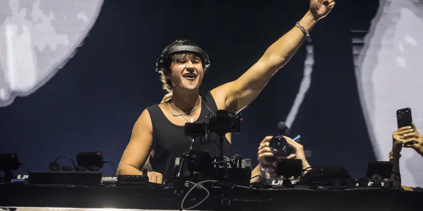 John Summit, American powerhouse DJ, performs on stage.