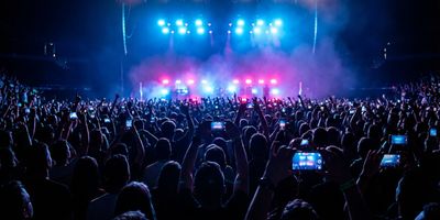 Concert fans attending a 2025 music festival performance.