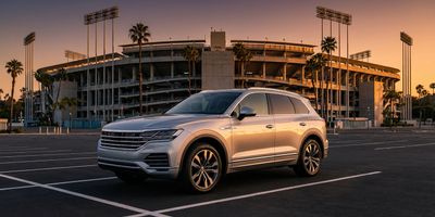 A panoramic view of a ballpark parking lot.