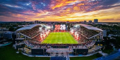 Soccer stadium welcoming 2026 on the screens.