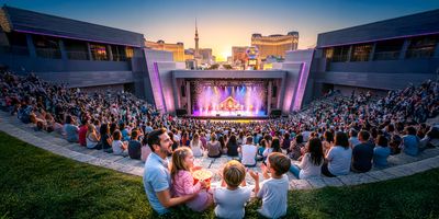 A family enjoys a kid-friendly live show at an outdoor Vegas venue.