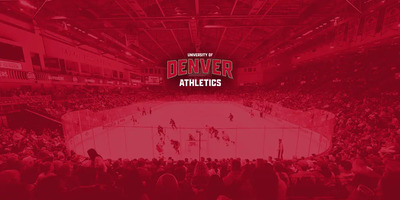 The Denver Pioneers Hockey team play in an arena with a red overlay.