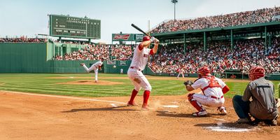 Boston Red Sox summer game action at Fenway Park.