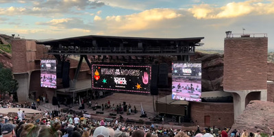 Film on the Rocks shown on the screen at Red Rocks Amphitheatre with a large crowd.
