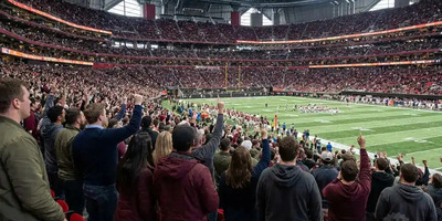 A group of soccer fans gather at Mercedez-Benz Stadium for a game.
