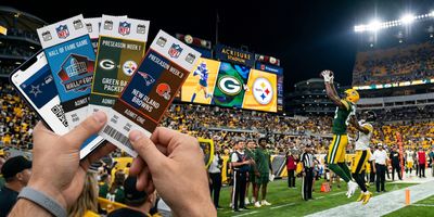 2026 NFL preseason tickets displayed in front of Acrisure Stadium during a night football game.