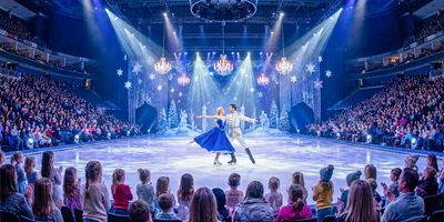 Disney on Ice skaters perform a winter routine for an arena crowd.