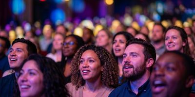 An audience watching a Broadway show.