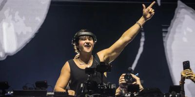 John Summit, American powerhouse DJ, performs on stage.