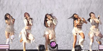 Katseye performs on stage.
